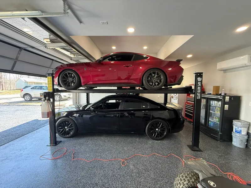 Four-post automotive lift installation