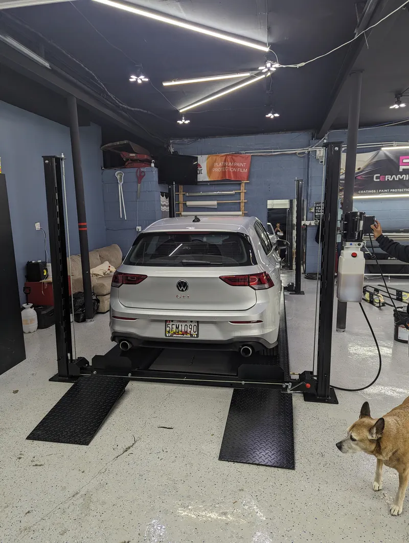 Four-post lift setup in garage