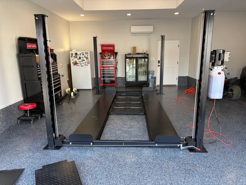 Four-post automotive lift installation