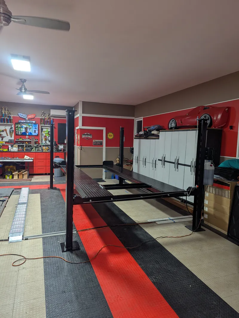Four-post lift setup in garage
