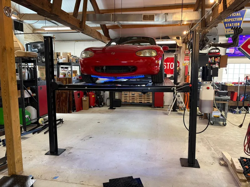 Four-post lift setup in garage