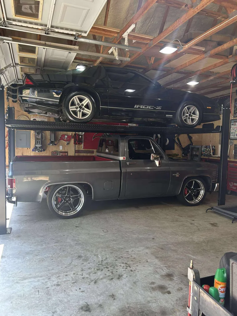 Four-post lift setup in garage